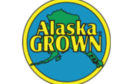 alaska grown logo. blue circke with green state silhouette