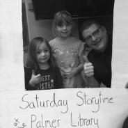 A flyer with a photo of Jeff and two young girls, "Saturday Storytime at the Palmer Library"